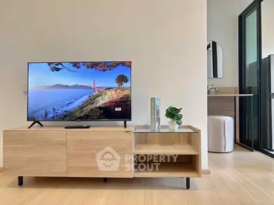 Modern living room with sleek TV stand and scenic view on screen.
