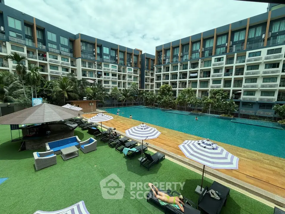 Luxurious apartment complex with stunning pool and modern amenities, perfect for resort-style living.