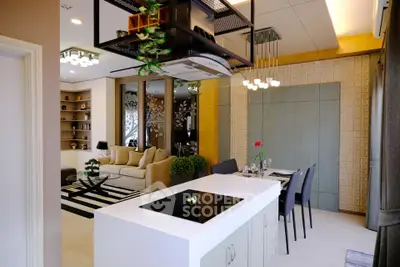 Modern open-plan kitchen and living room with stylish decor and dining area
