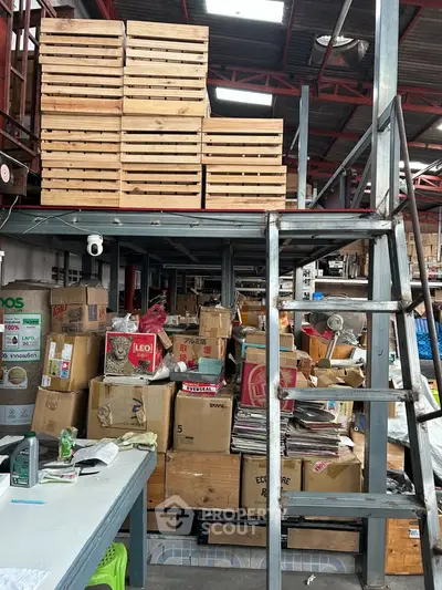 Spacious warehouse with mezzanine storage and organized shelving, ideal for efficient inventory management.