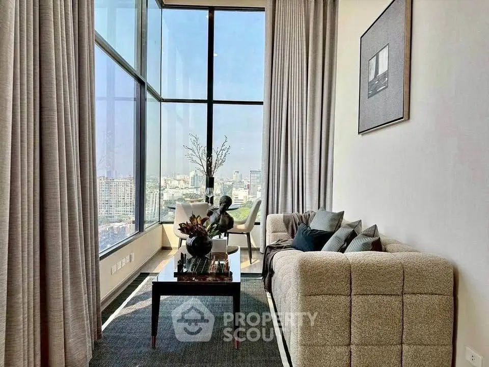 Luxurious high-rise living room with panoramic city views and elegant decor.