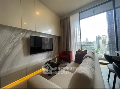 Modern living room with city view, sleek furniture, and large TV