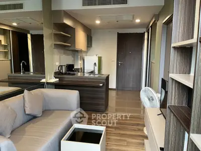 Modern open-plan living room with sleek kitchen and stylish decor
