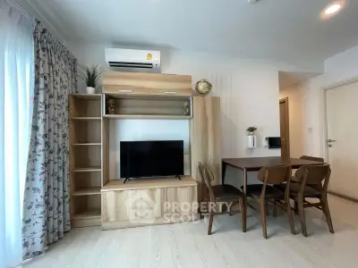 Modern living room with wooden furniture and air conditioning, featuring a cozy dining area and natural light.