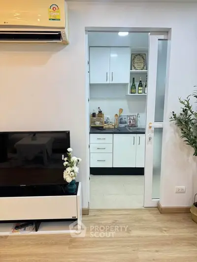 Modern apartment interior with cozy living room and compact kitchen