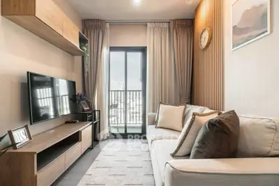 Modern living room with stylish decor and balcony view