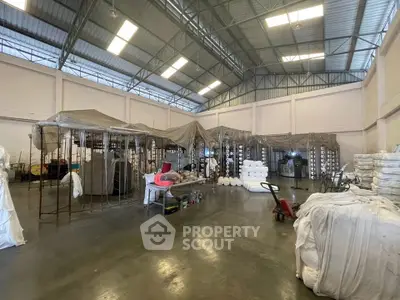 Spacious industrial warehouse with high ceilings and ample storage space.