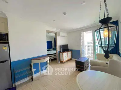 Spacious living room with modern decor and balcony access