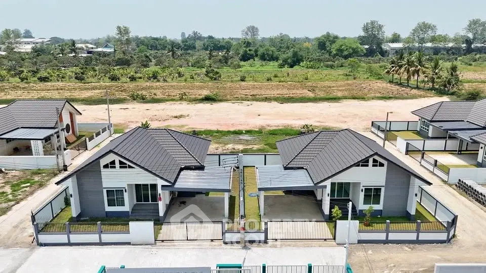 Modern twin houses with sleek design and spacious yards in a serene neighborhood.