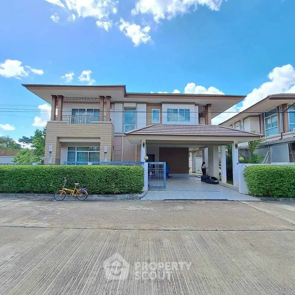 Stunning modern two-story house with lush greenery and spacious driveway in a serene neighborhood.