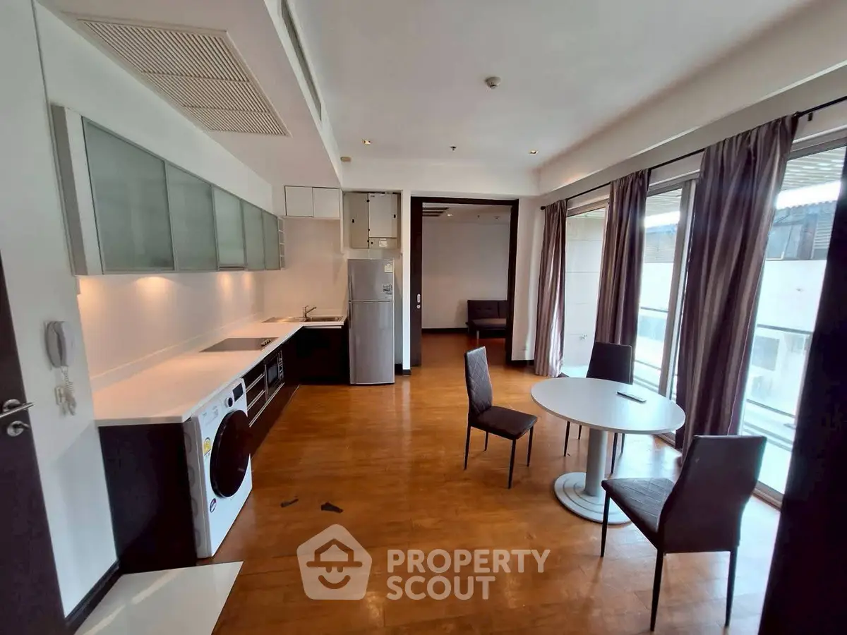 Spacious modern living room with open kitchen and large windows