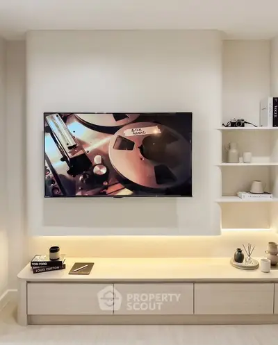 Modern living room with sleek TV setup and stylish shelving