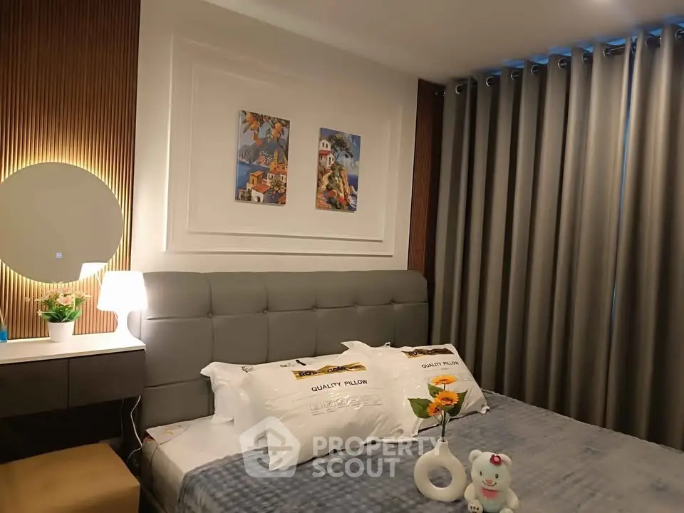 Cozy modern bedroom with stylish decor and plush bedding, perfect for relaxation.