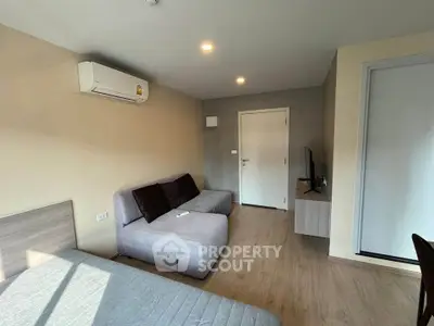 Modern living room with air conditioning and stylish furniture in a cozy apartment.