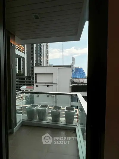 Modern balcony with city view and sleek railing in urban apartment