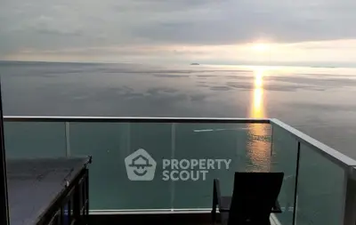 Stunning ocean view from a modern balcony at sunset, perfect for relaxation and enjoying serene moments.