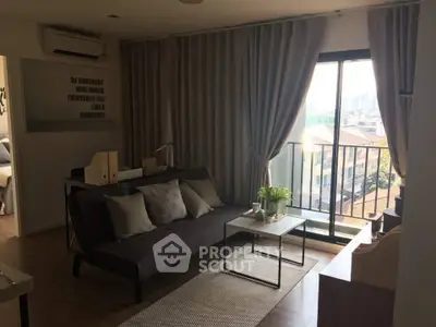 Chic living room with balcony view in modern apartment