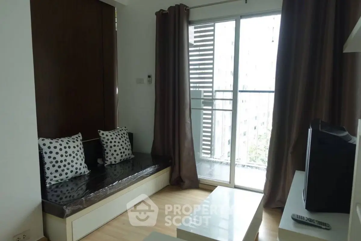 Cozy living room with balcony access and modern decor
