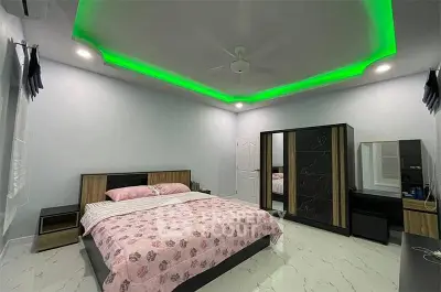 Spacious modern bedroom with stylish ceiling lighting and elegant furniture.
