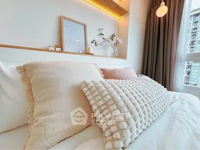 Cozy and stylish bedroom with modern decor and large window view.