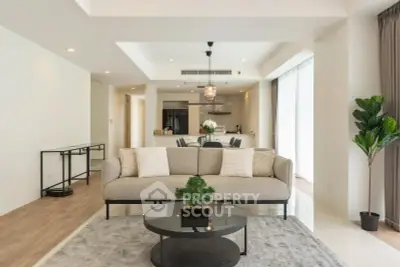 Spacious modern living room with elegant decor and open kitchen layout
