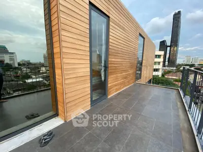 Modern urban balcony with city view and sleek wooden paneling