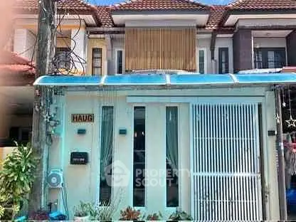 Charming townhouse with modern facade and rooftop terrace in a vibrant neighborhood.