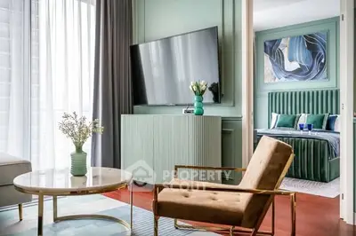 Stylish modern living room with elegant decor and view into a chic bedroom