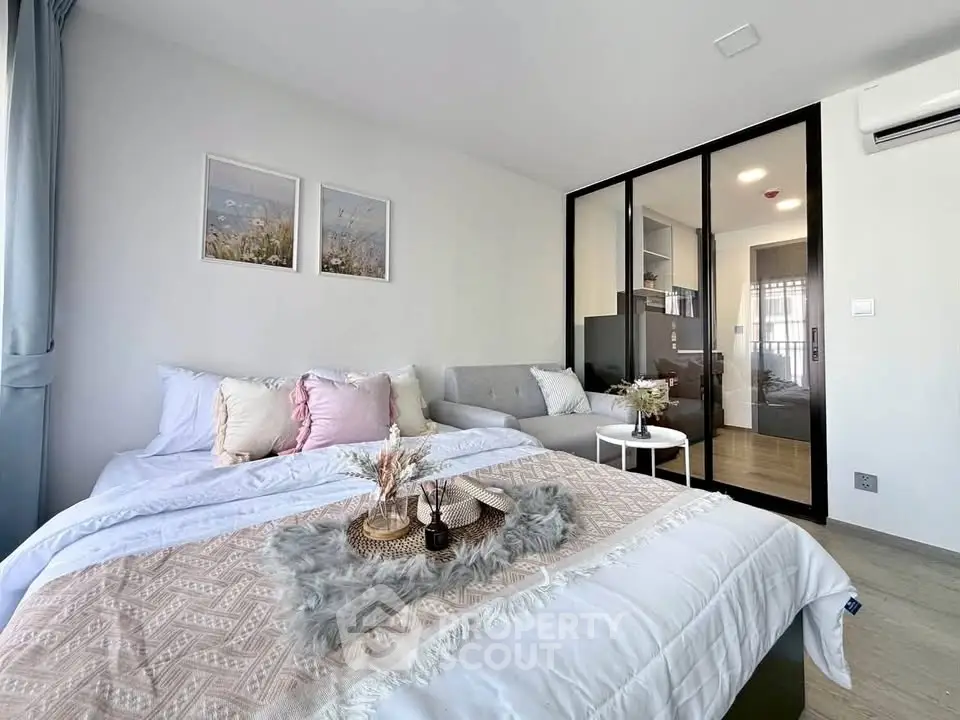 Modern bedroom with cozy decor and glass partition in stylish apartment