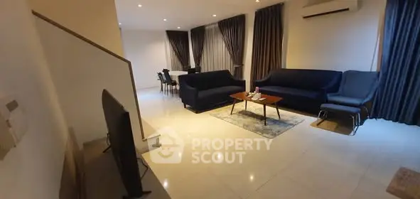 Spacious modern living room with elegant furniture and ambient lighting