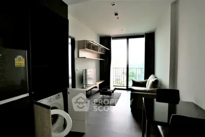 Modern living room with balcony view, featuring sleek furniture and natural light.