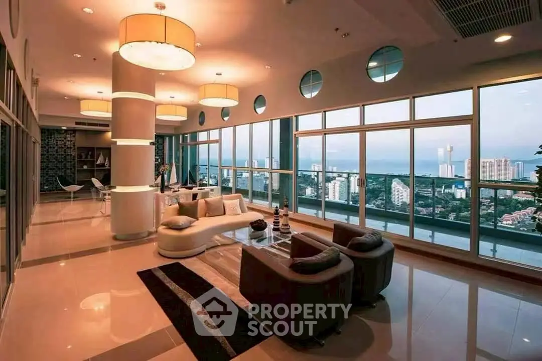 Luxurious living room with panoramic city views and elegant modern decor.