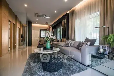 Luxurious modern living room with elegant decor and plush seating.
