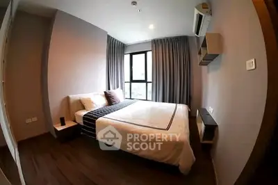 Modern bedroom with large window and stylish decor