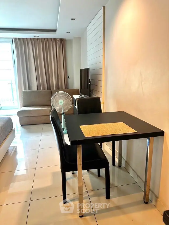 Modern living room with sleek furniture and natural light, perfect for urban living.