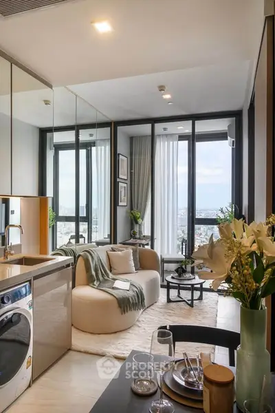 Modern living room with open kitchen, featuring stylish decor and large windows offering a stunning city view.