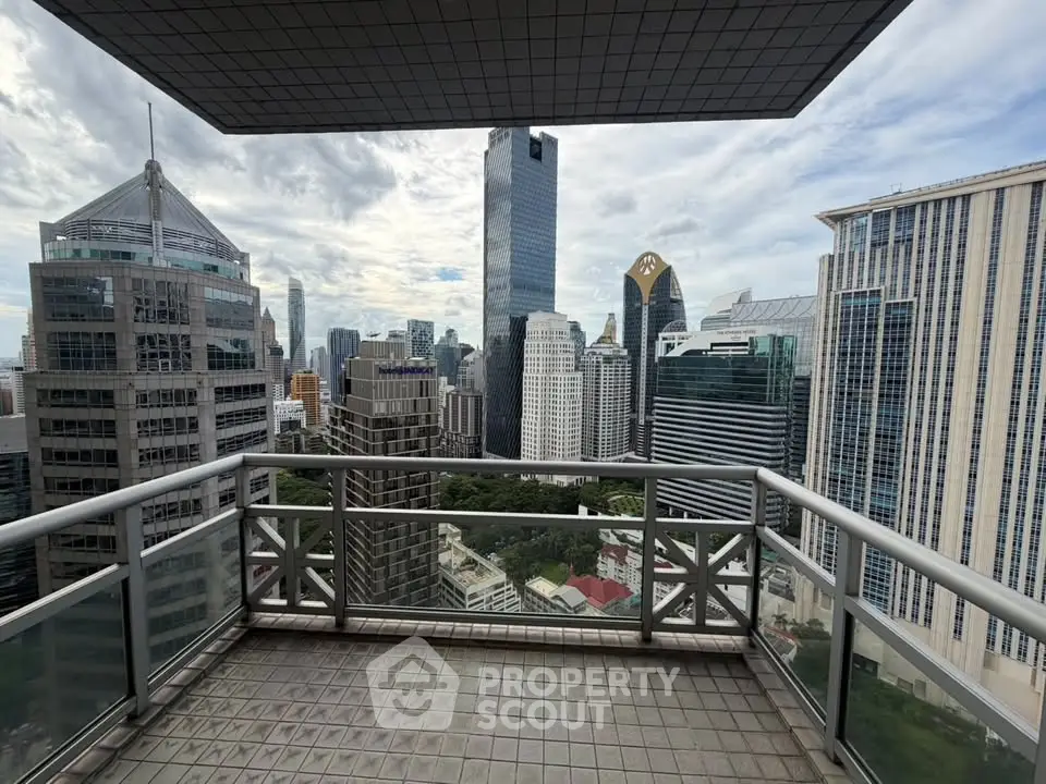 Stunning cityscape view from a high-rise balcony in a modern urban setting.