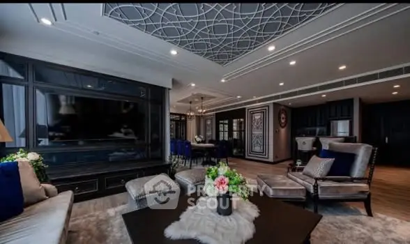 Luxurious living room with elegant decor and spacious layout, featuring modern furniture and stylish ceiling design.
