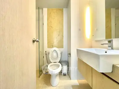 Modern bathroom with elegant fixtures and stylish lighting