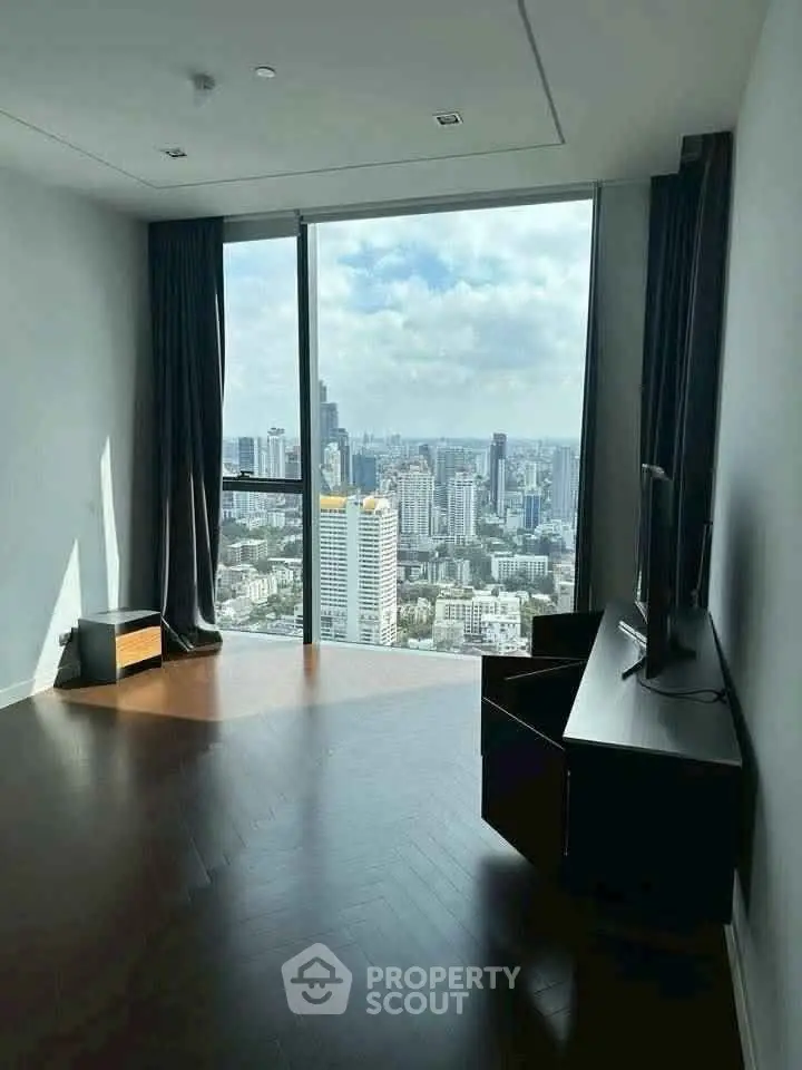 Spacious room with stunning city view and modern furnishings.