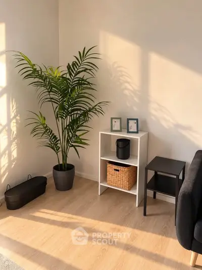 Bright and minimalist living room corner with stylish decor and natural light.