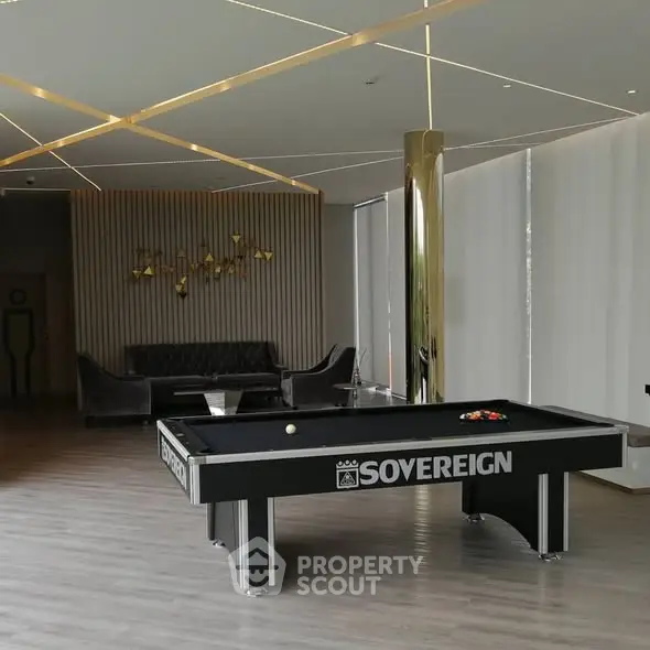 Luxurious modern living room with pool table and elegant decor
