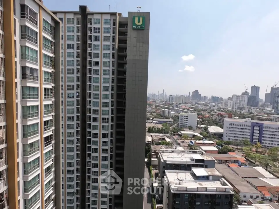 Stunning high-rise building with panoramic city views in vibrant urban setting.