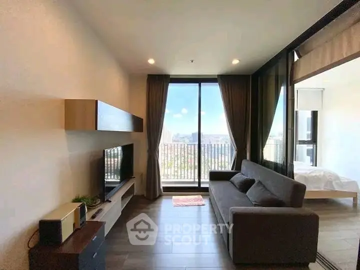Modern living room with balcony view and sleek furnishings