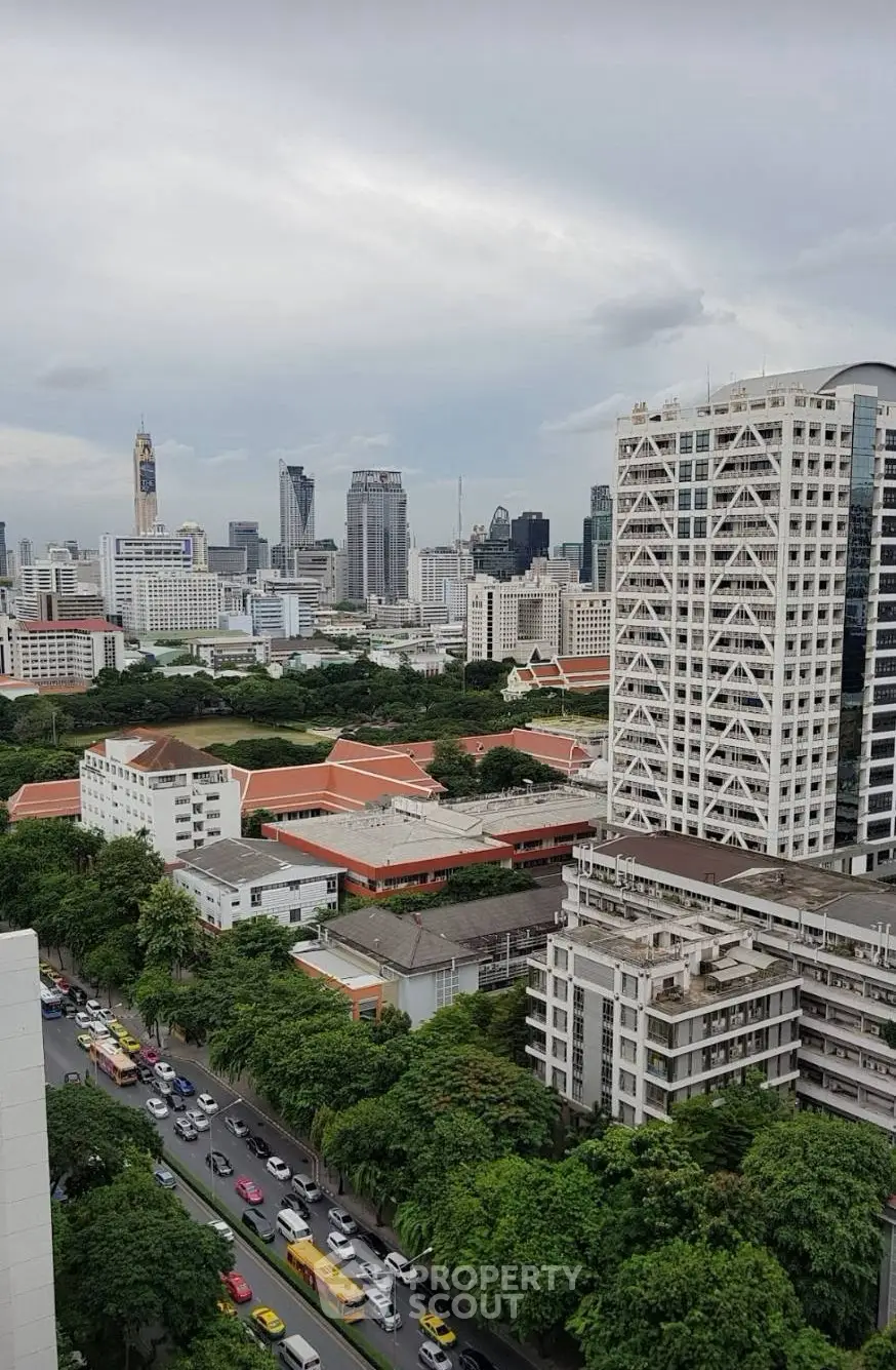 Stunning cityscape view showcasing urban skyline and lush greenery, perfect for real estate investment.