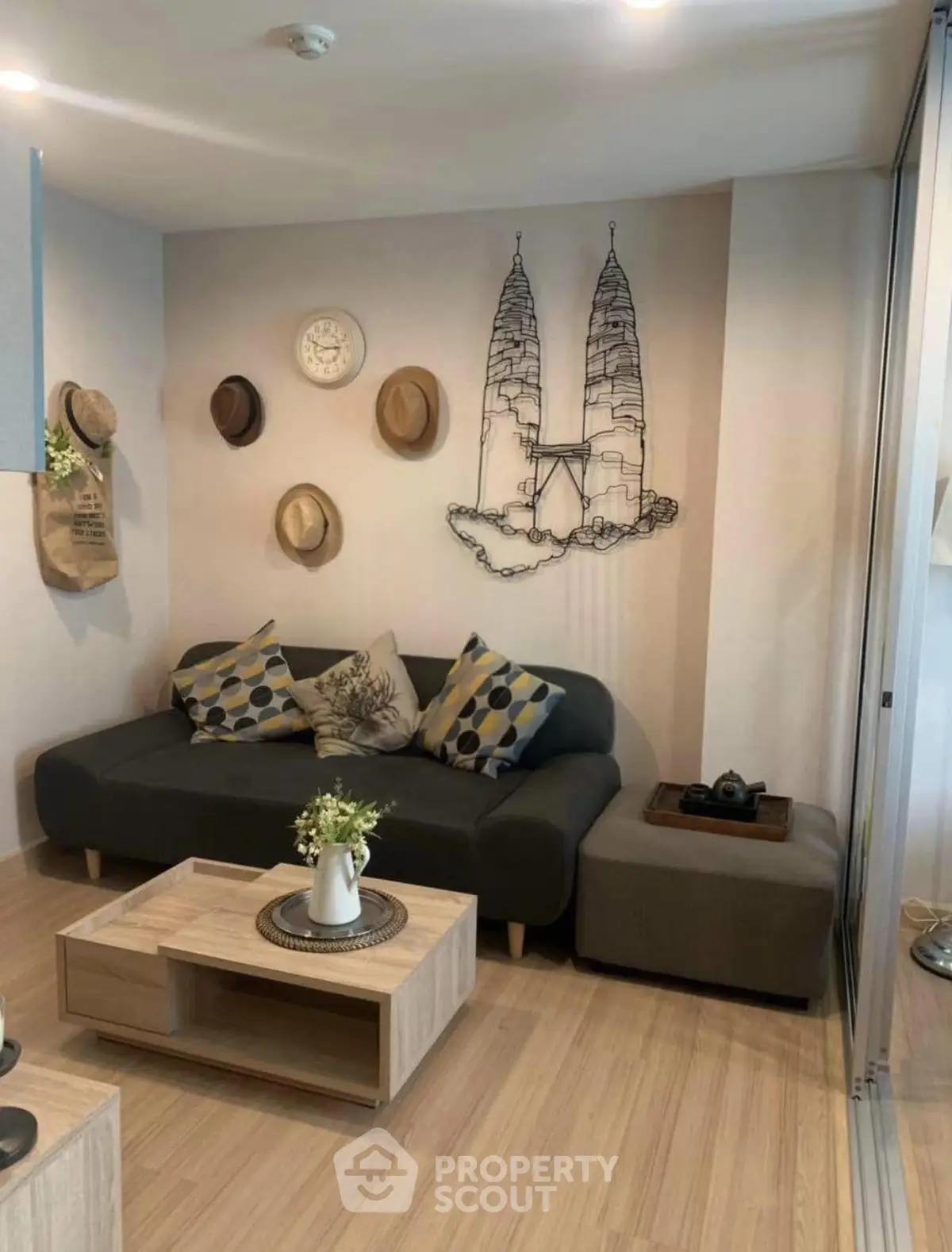 Stylish living room with modern decor and cozy seating area, perfect for relaxation.