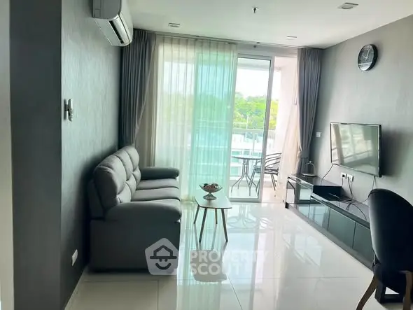 Modern living room with sleek furniture and balcony view