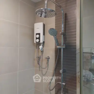 Modern bathroom with sleek shower fixtures and water heater