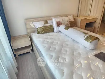 Modern bedroom with new mattress and stylish wooden furniture in a cozy apartment.