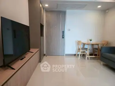 Modern living room with sleek furniture and natural light, perfect for cozy gatherings.